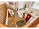 Grand foyer showcasing hardwood floors, a red front door, a staircase and an elegant chandelier at 1820 Sapling Ct, Castle Rock, CO 80109