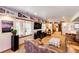 Cozy basement living area featuring large windows, comfortable seating, and sports decor at 1820 Sapling Ct, Castle Rock, CO 80109