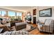 Comfortable living area with hardwood floors, scenic views, and stylish furnishings at 1820 Sapling Ct, Castle Rock, CO 80109