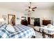 Relaxing main bedroom with a vaulted ceiling, plush furnishings, and view of the ensuite bathroom at 1820 Sapling Ct, Castle Rock, CO 80109