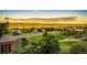 Picturesque community view showcasing the town and golf course surrounded by lush greenery and a striking sky at 1820 Sapling Ct, Castle Rock, CO 80109