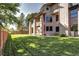 Landscaped backyard with a lawn and wooden fence at 10697 W Roxbury Ave, Littleton, CO 80127