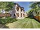 Spacious backyard with well-manicured lawn and wooden fence at 10697 W Roxbury Ave, Littleton, CO 80127