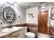 Basement bathroom with updated vanity and fixtures at 10697 W Roxbury Ave, Littleton, CO 80127