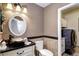 Elegant bathroom with a vessel sink, granite countertop, and updated fixtures at 10697 W Roxbury Ave, Littleton, CO 80127