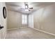 Simple bedroom with ceiling fan and double door closet at 10697 W Roxbury Ave, Littleton, CO 80127