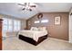 Main bedroom with high ceilings, neutral walls, and plush carpeting at 10697 W Roxbury Ave, Littleton, CO 80127