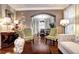 Formal dining room with hardwood floors and a view of the kitchen at 10697 W Roxbury Ave, Littleton, CO 80127