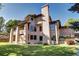 Brick house exterior with large windows and a backyard at 10697 W Roxbury Ave, Littleton, CO 80127