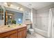 Cozy bathroom with double sinks and tub and shower combo with a window at 1190 W 11Th Ct, Broomfield, CO 80020