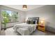 Cozy bedroom with a large window, neutral colors, and stylish decor at 1190 W 11Th Ct, Broomfield, CO 80020