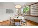 Bright dining room includes a decorative light fixture and hardwood floors, plus ample light at 1190 W 11Th Ct, Broomfield, CO 80020