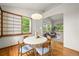 Dining room boasts natural light with views to living room, modern decor, and hardwood floors at 1190 W 11Th Ct, Broomfield, CO 80020
