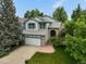 Charming two-story home with a well-manicured lawn and a two car garage at 1190 W 11Th Ct, Broomfield, CO 80020