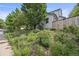Beautifully landscaped front yard with a variety of plants and flowers at 1190 W 11Th Ct, Broomfield, CO 80020