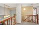 Hallway boasts gorgeous railing and stairs with plenty of natural light from the foyer at 1190 W 11Th Ct, Broomfield, CO 80020