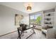 Comfortable office space with a large window, built-in shelves, and modern decor at 1190 W 11Th Ct, Broomfield, CO 80020