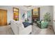 Cozy living room with a fireplace, modern ceiling fan and comfortable seating at 1190 W 11Th Ct, Broomfield, CO 80020