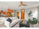 Stylish living room with wood accents, comfortable seating, and views into kitchen at 1190 W 11Th Ct, Broomfield, CO 80020