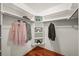 Well-organized walk-in closet with shelving and hanging racks for clothing storage at 1190 W 11Th Ct, Broomfield, CO 80020