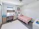 Bedroom with carpet, bed, desk, and chair at 8951 E 59Th Pl, Denver, CO 80238