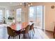 Dining area with hardwood floors, modern lighting, and sliding glass doors leading to the backyard at 8951 E 59Th Pl, Denver, CO 80238