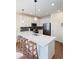 Bright kitchen with a quartz countertop, stainless appliances, and a stylish backsplash at 8951 E 59Th Pl, Denver, CO 80238