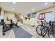 Finished basement recreation area with exercise equipment and bikes at 7261 E Hinsdale Ave, Centennial, CO 80112