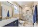 Updated bathroom with a walk-in shower, modern vanity, and stylish fixtures at 7261 E Hinsdale Ave, Centennial, CO 80112