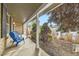 Front porch with blue chairs, overlooking the front yard at 7261 E Hinsdale Ave, Centennial, CO 80112