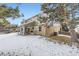 Rear exterior showcasing a covered patio and fenced backyard at 7261 E Hinsdale Ave, Centennial, CO 80112