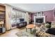 Living room with hardwood floors, fireplace, and large windows at 7261 E Hinsdale Ave, Centennial, CO 80112