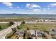 Scenic aerial view showcasing homes, highways, and majestic mountain backdrop at 3787 Bucknell Dr, Highlands Ranch, CO 80129