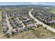 Expansive aerial view of a neighborhood featuring tree-lined streets and neatly arranged homes at 3787 Bucknell Dr, Highlands Ranch, CO 80129