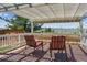 Charming covered deck with scenic mountain views and comfortable seating at 3787 Bucknell Dr, Highlands Ranch, CO 80129