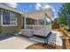Backyard featuring a covered deck area, landscaping, and a stone birdbath at 3787 Bucknell Dr, Highlands Ranch, CO 80129