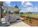 Backyard featuring a covered deck area with mountain views and wood fencing at 3787 Bucknell Dr, Highlands Ranch, CO 80129