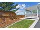 Backyard with a covered deck, lawn, landscaping and views of the mountains at 3787 Bucknell Dr, Highlands Ranch, CO 80129