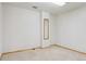 Spacious unfinished basement with neutral carpet and a full length mirror on the back wall at 3787 Bucknell Dr, Highlands Ranch, CO 80129
