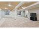 Finished basement with a ceiling fan and large windows for natural light at 3787 Bucknell Dr, Highlands Ranch, CO 80129