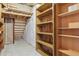 Unfinished basement featuring exposed beams and open shelving for ample storage at 3787 Bucknell Dr, Highlands Ranch, CO 80129