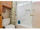 Clean bathroom featuring a shower-tub with white tile and a floral shower curtain at 3787 Bucknell Dr, Highlands Ranch, CO 80129