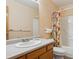 Bathroom featuring a single sink, floral shower curtain, and a shower-tub combo at 3787 Bucknell Dr, Highlands Ranch, CO 80129