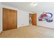 Bedroom with tan carpet, light walls, and a closet ready for personalization at 3787 Bucknell Dr, Highlands Ranch, CO 80129