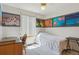 Bedroom featuring a ceiling fan and unique decorative wall art with filmstrip design at 3787 Bucknell Dr, Highlands Ranch, CO 80129