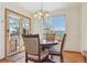 Light-filled dining area with mountain views, hardwood floors, and backyard access at 3787 Bucknell Dr, Highlands Ranch, CO 80129