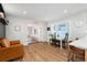 Bright dining area features hardwood floors and view into the living room at 1059 S Alkire St, Lakewood, CO 80228