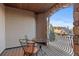 Outdoor patio showcasing the exterior and architecture of the home and wrought-iron railing at 5810 Amber Ridge Dr, Castle Pines, CO 80108