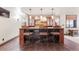 Entertain in style at this bar featuring stone accents and elegant pendant lighting at 5810 Amber Ridge Dr, Castle Pines, CO 80108
