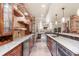 Stylish basement bar with granite countertops, stainless steel appliances, and ample storage at 5810 Amber Ridge Dr, Castle Pines, CO 80108